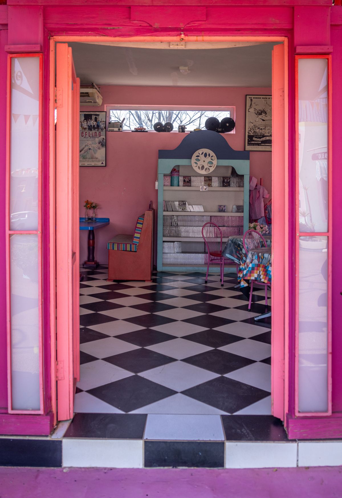 Placeholder photograph of a pink café interior detail.