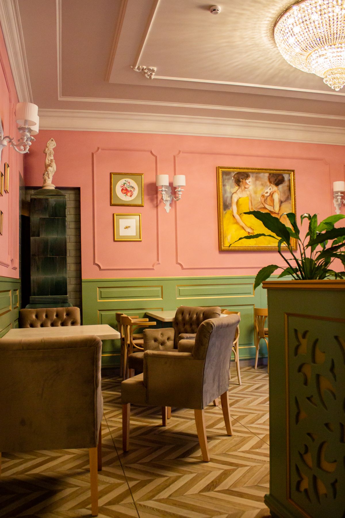 Placeholder photograph of a pink wall and chairs.