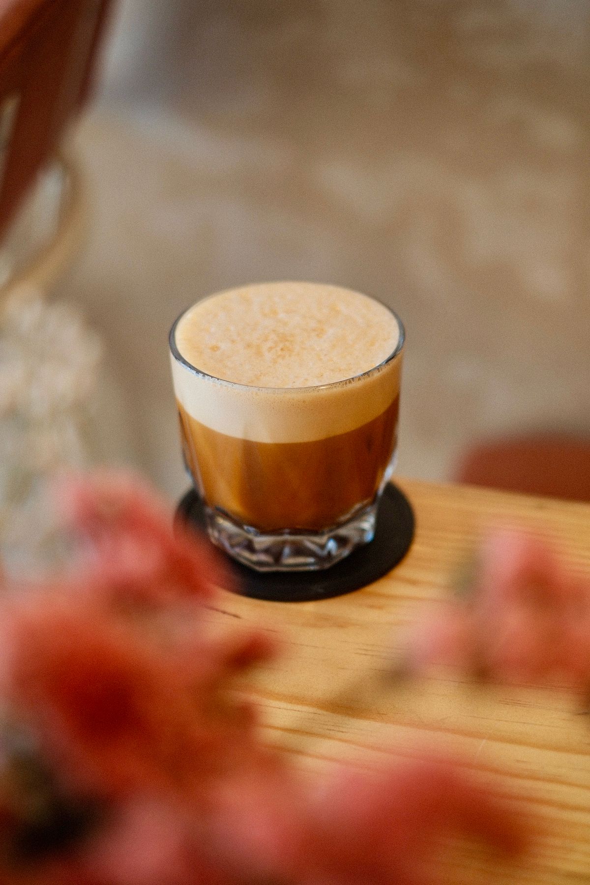 Placeholder photograph of a coffee cup in hand.