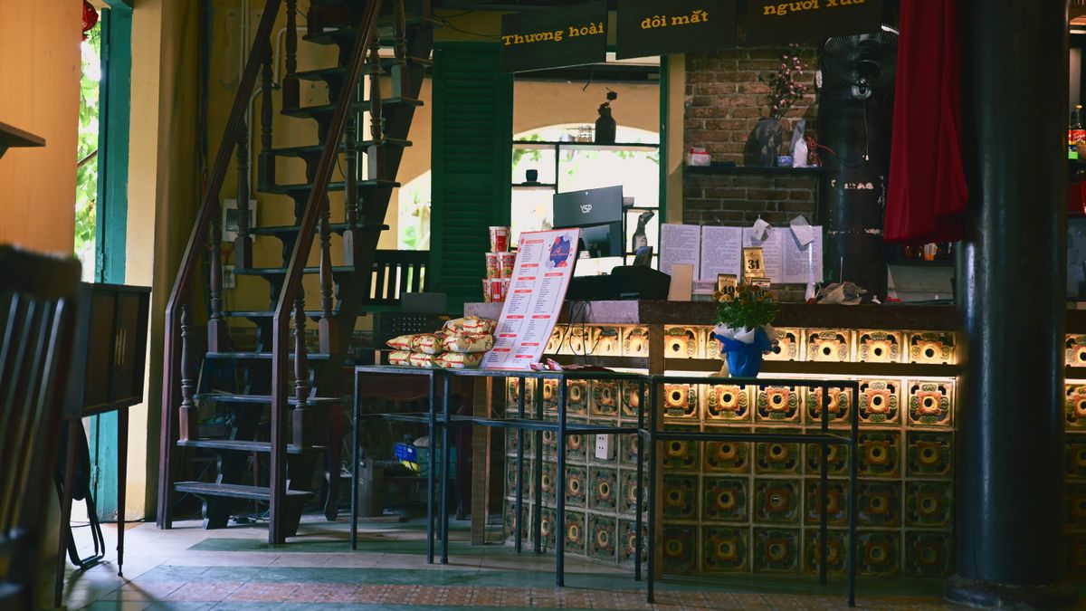 Placeholder photograph of a wide pink café interior.