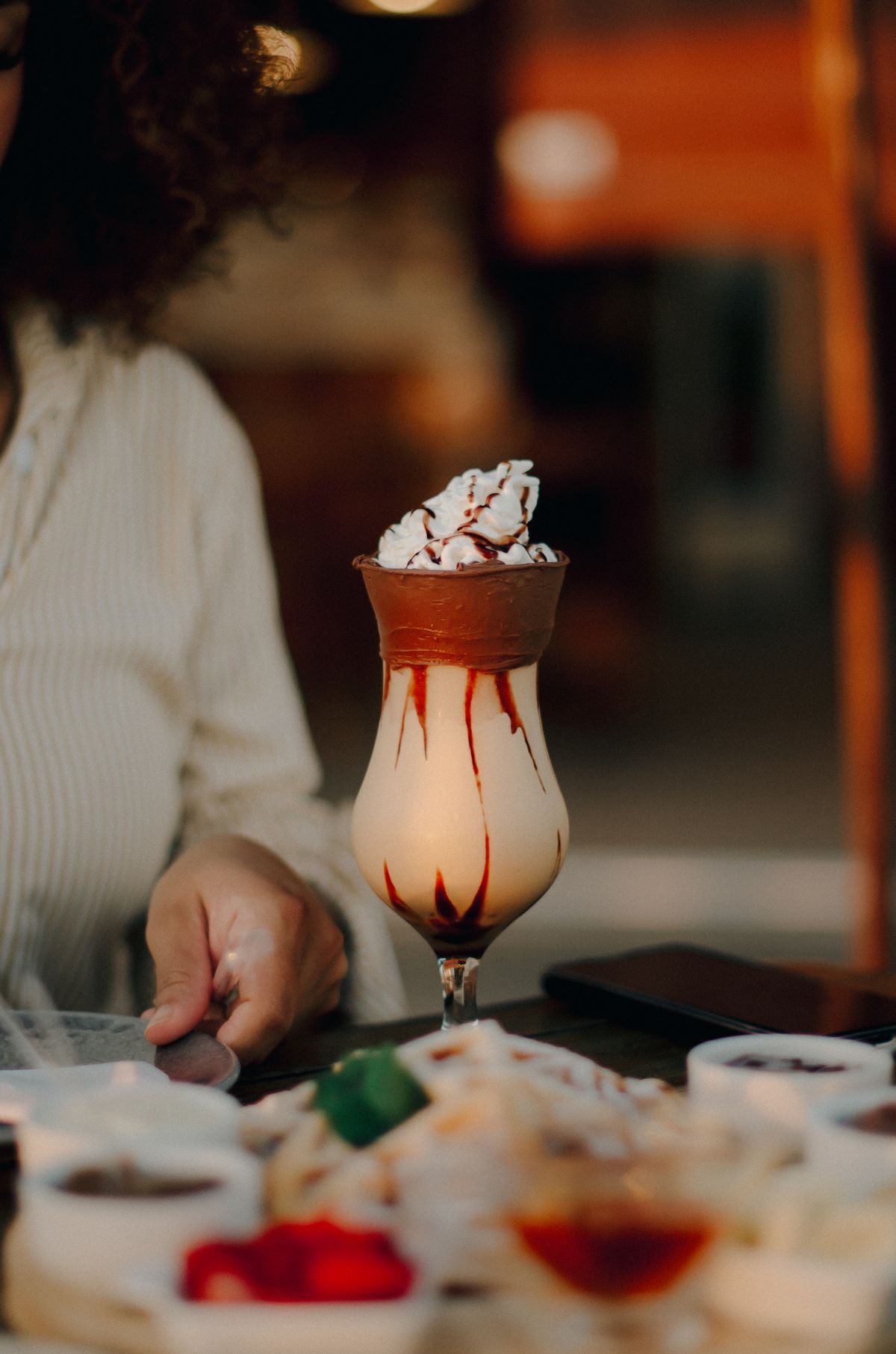 Placeholder photograph of a blended frozen drink on a café table.