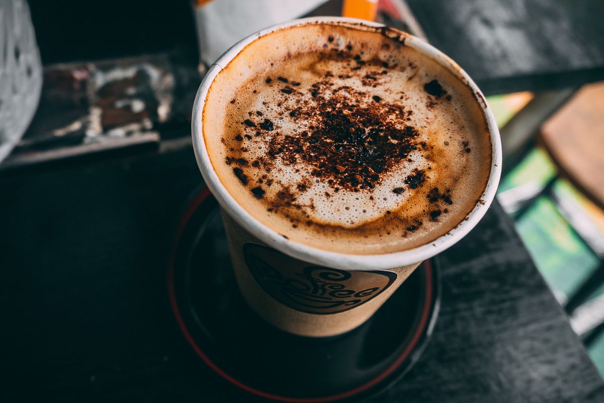 Placeholder photograph of a mocha in a cup on a café table.